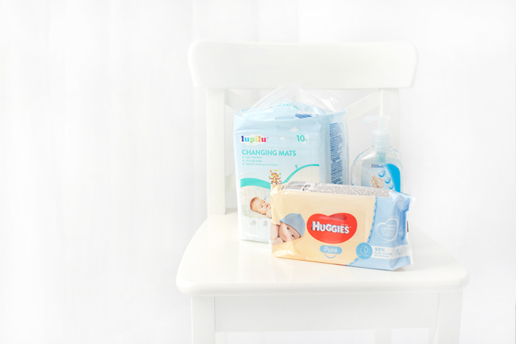 I use wet wipes with 99% water. I have an individual diaper pad for each baby.